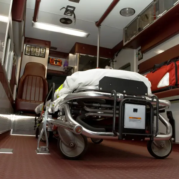 Non-emergency stretcher transport equipment used to illustrate planned patient transfers